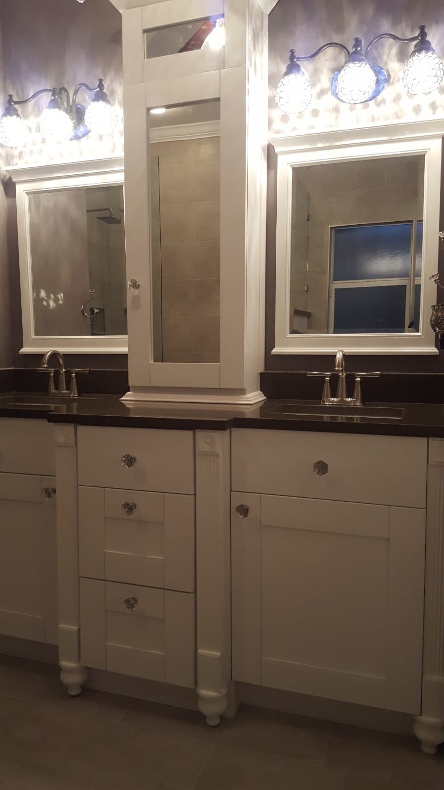 Elegant white bathroom vanity with two sinks and mirrors