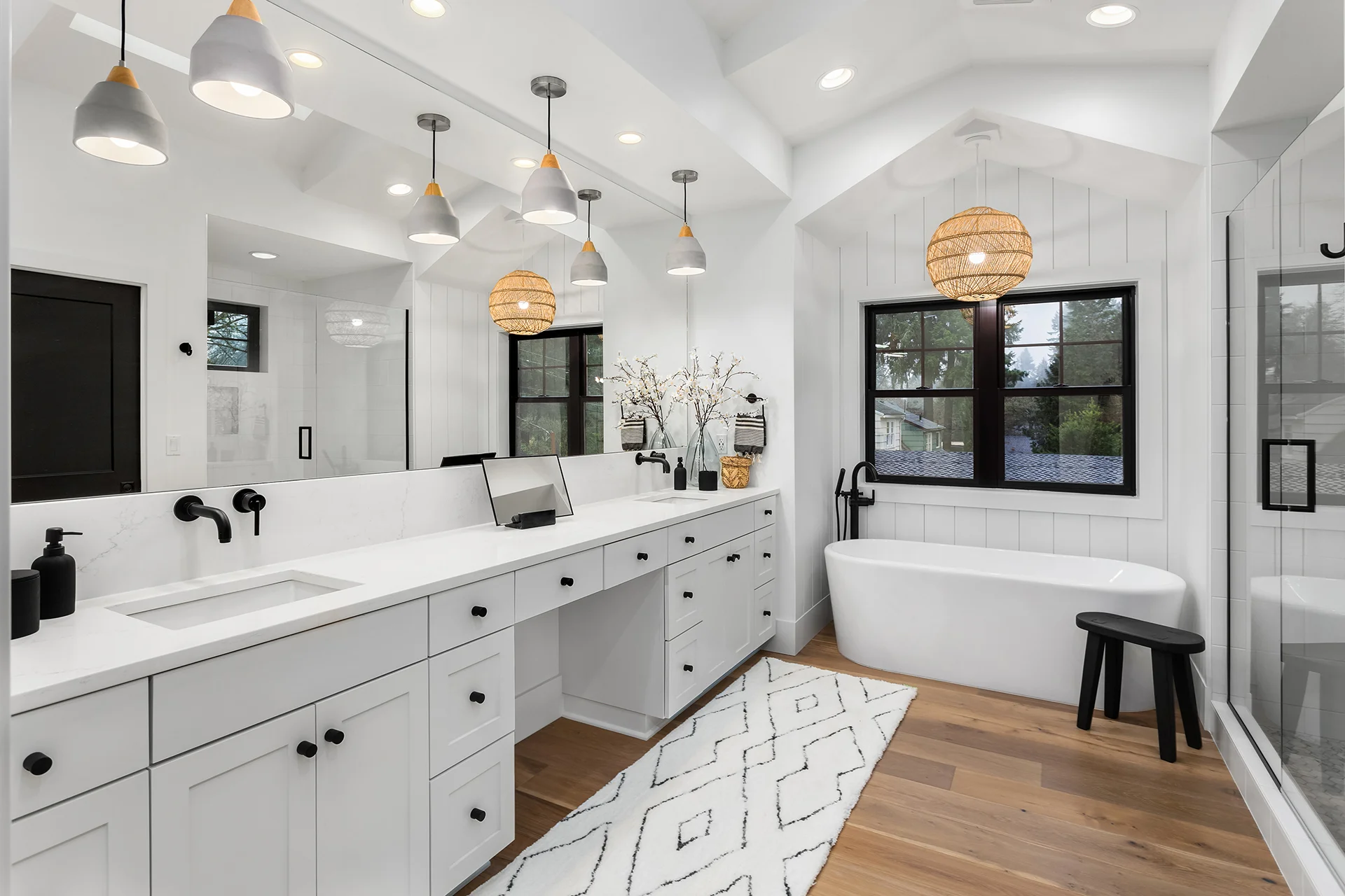 Modern farmhouse master bathroom with a double vanity and freestanding tub